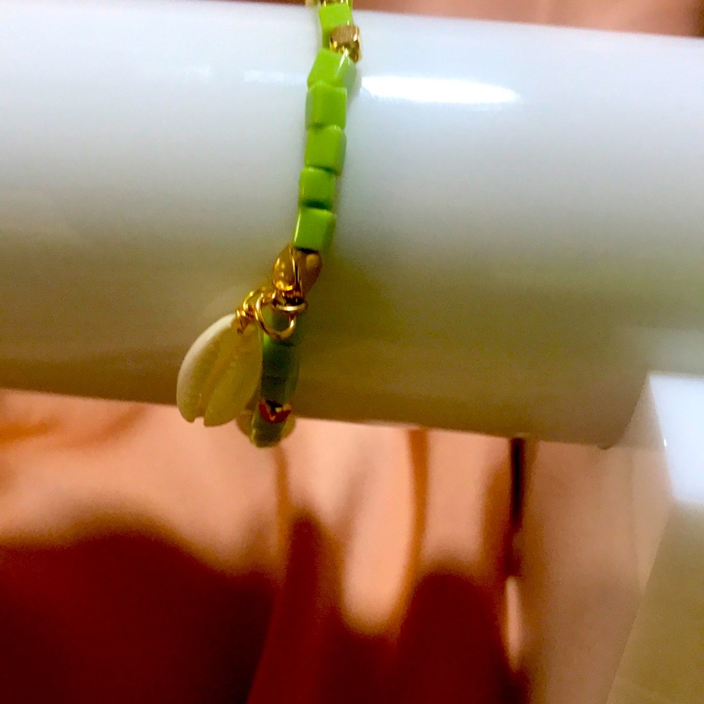 Beaded beach charm bracelet by Mayamar green with shell and pearl charm